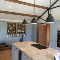 Black drop down lights on chains lighting up kitchen island, Lakenheath