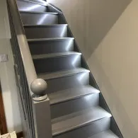 Home staircase lighting grey stairs with white walls, Lakenheath