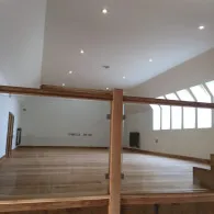 Upstairs in home with lighting coming through 5 windows